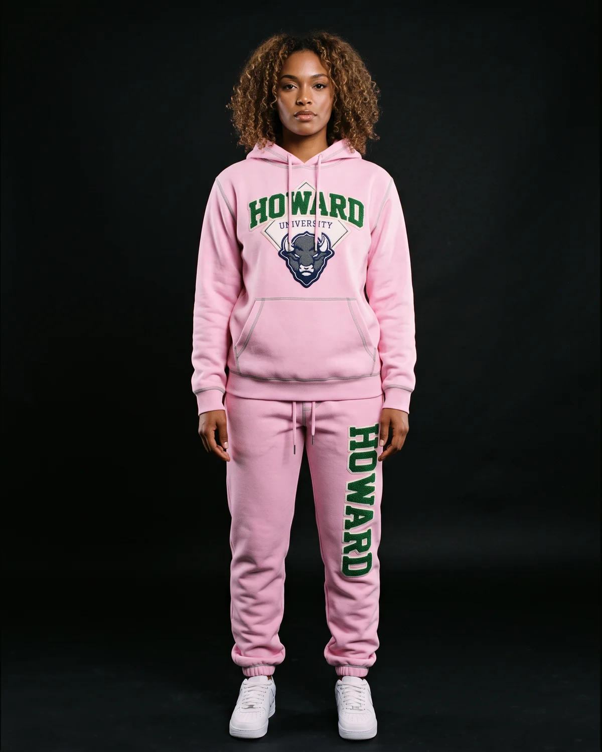 Model in a pink university hoodie and sweatpant set